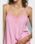 Close-up of a pink lace-trimmed top worn by a person on a white background