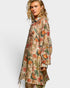 Woman wearing a floral patterned dress on a white background