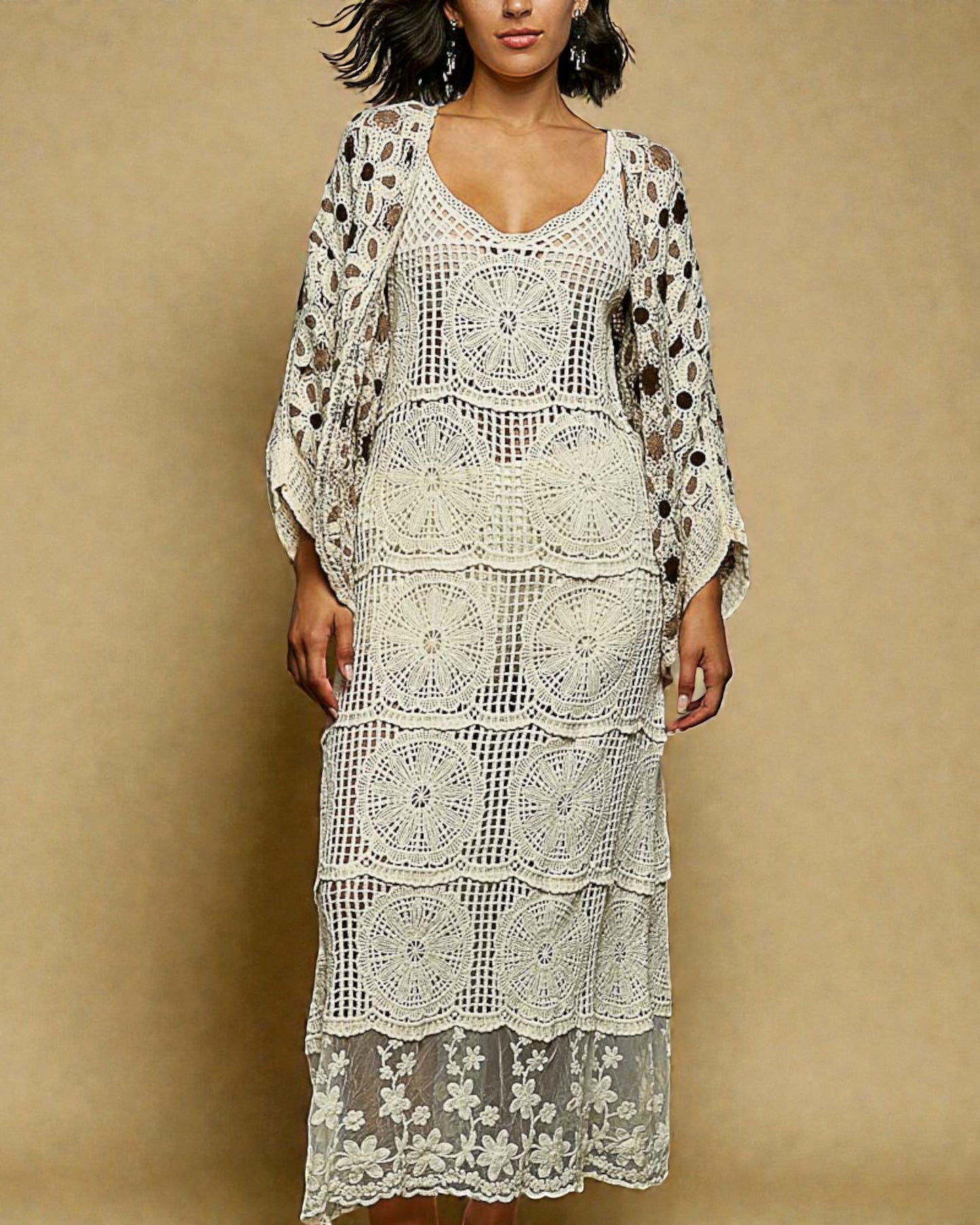 Woman wearing a white crochet dress with a beige background