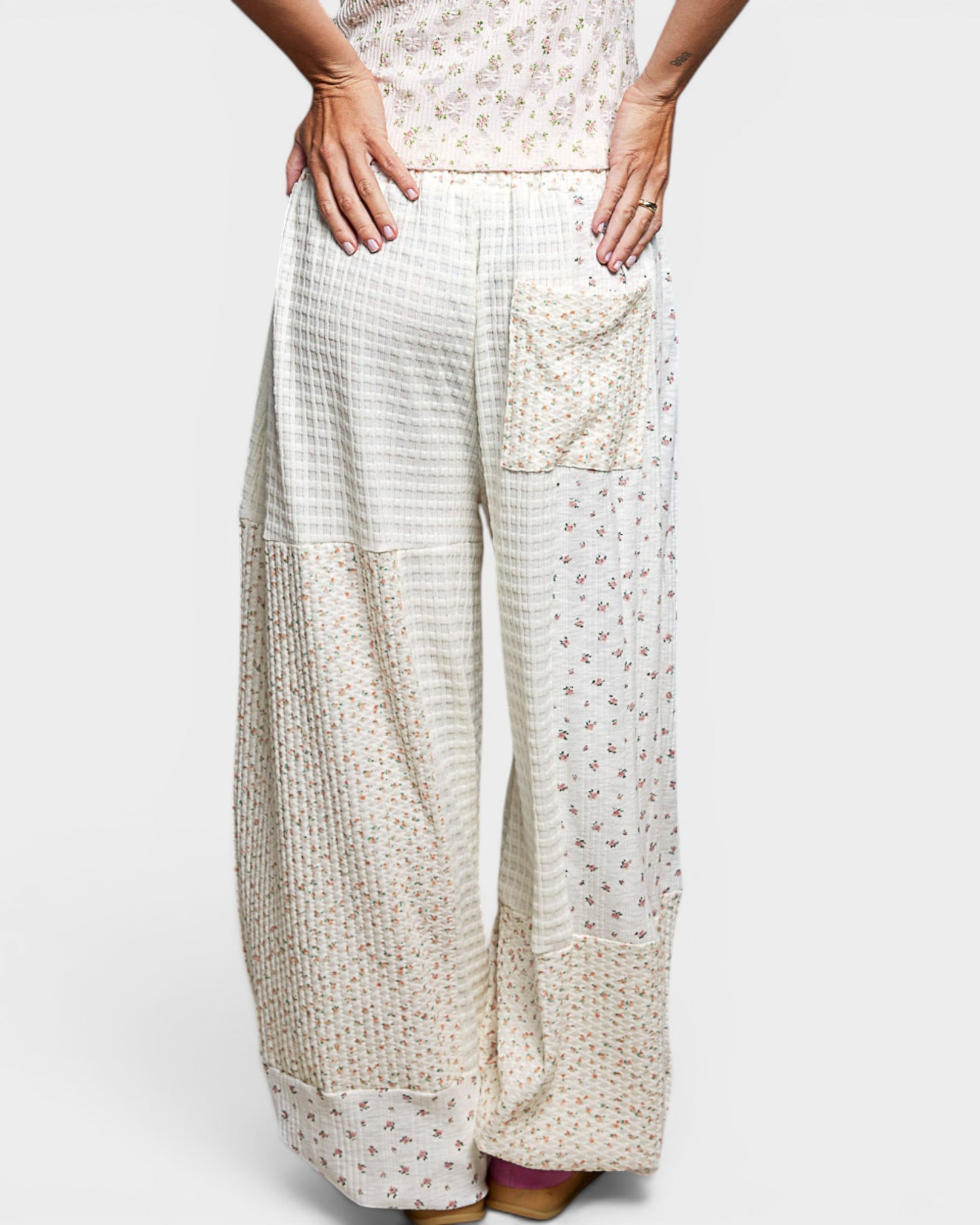White checkered pants with a pocket on a white background