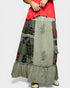 Long, patchwork skirt with floral and paisley patterns on a plain background