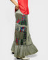 Long, patterned skirt with colorful patches on a white background