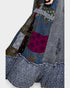 Patchwork fabric with various patterns and colors on a white background