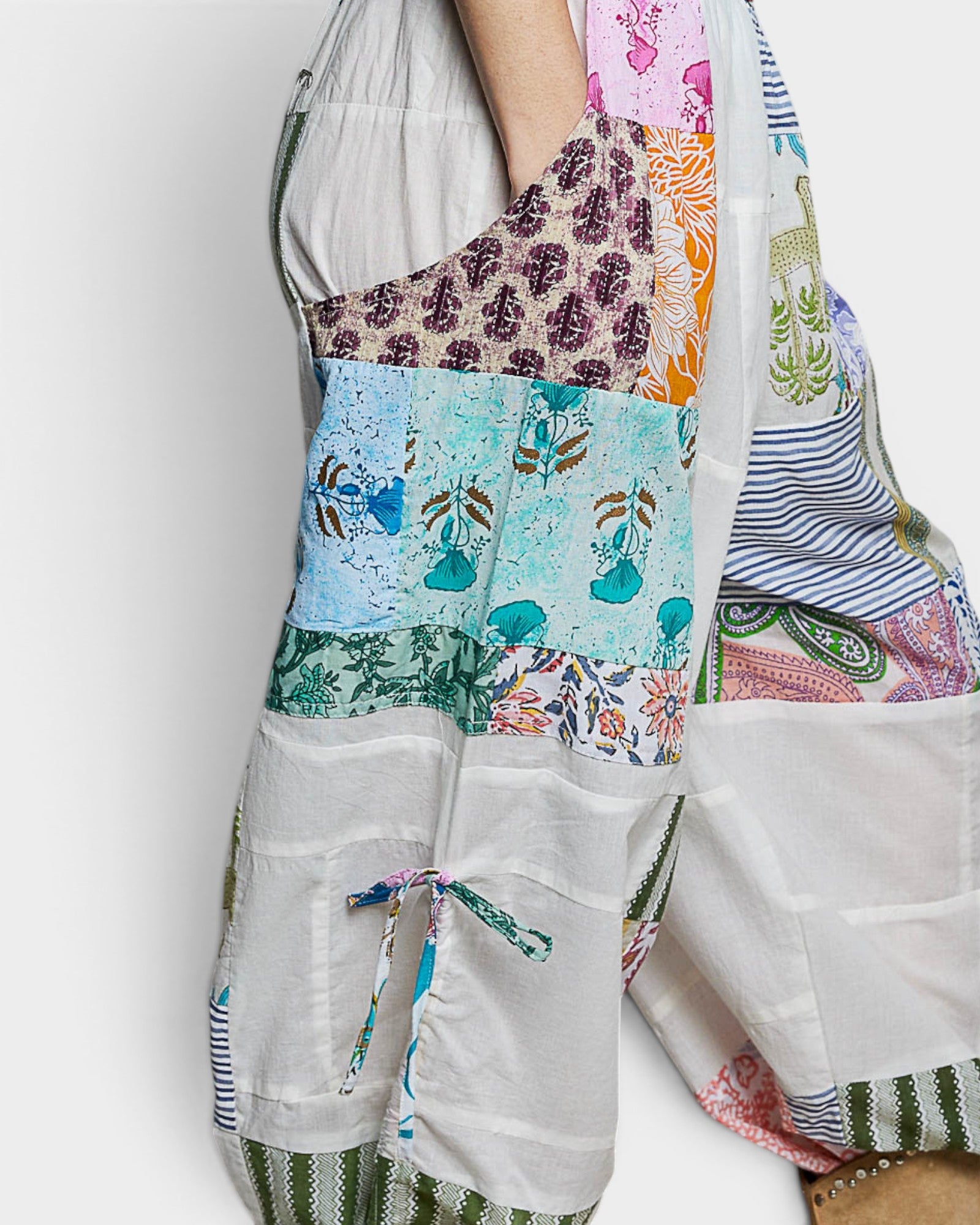 Colorful patchwork apron with various patterns on a white background