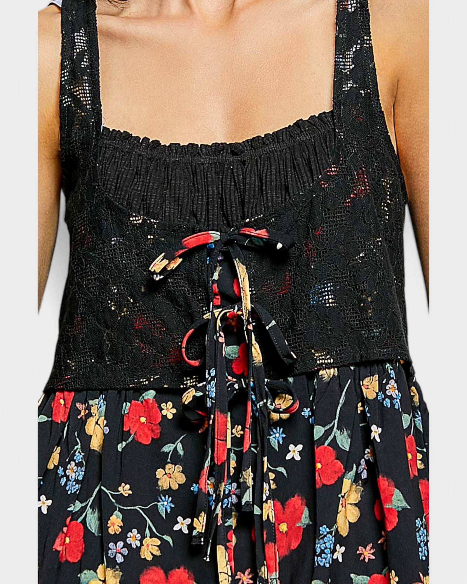 Black floral dress with colorful flowers on a white background