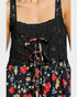 Black floral dress with colorful flowers on a white background