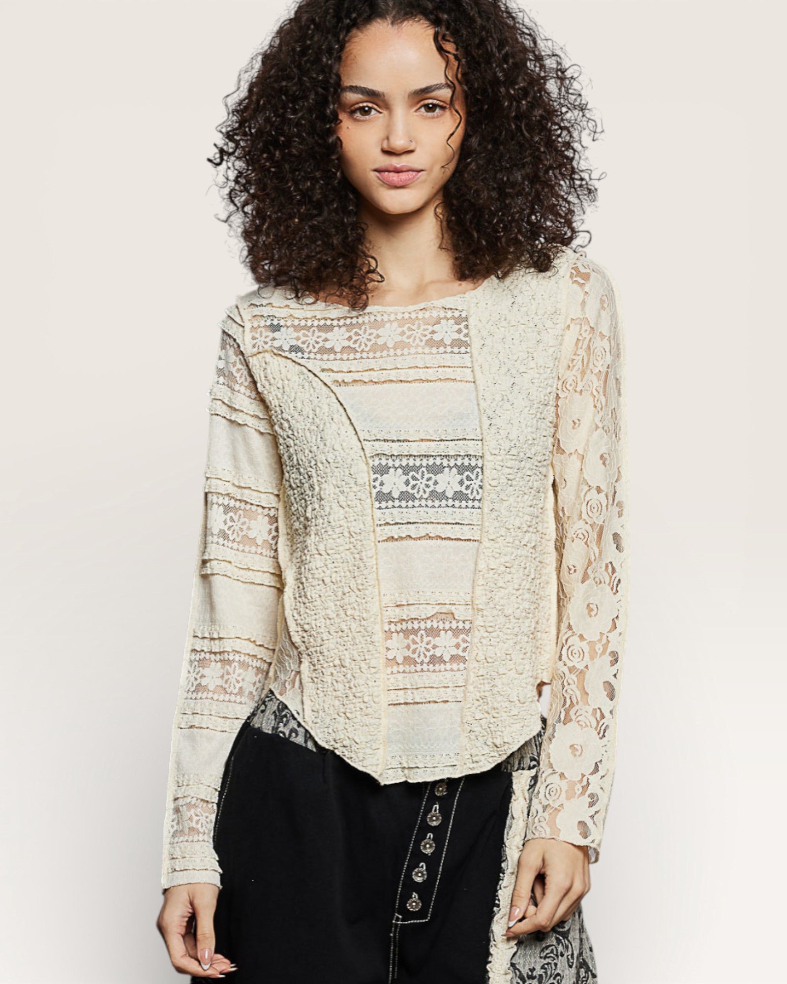 Woman wearing a patterned blouse with a plain background