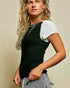 Woman wearing a black and white top with a neutral background