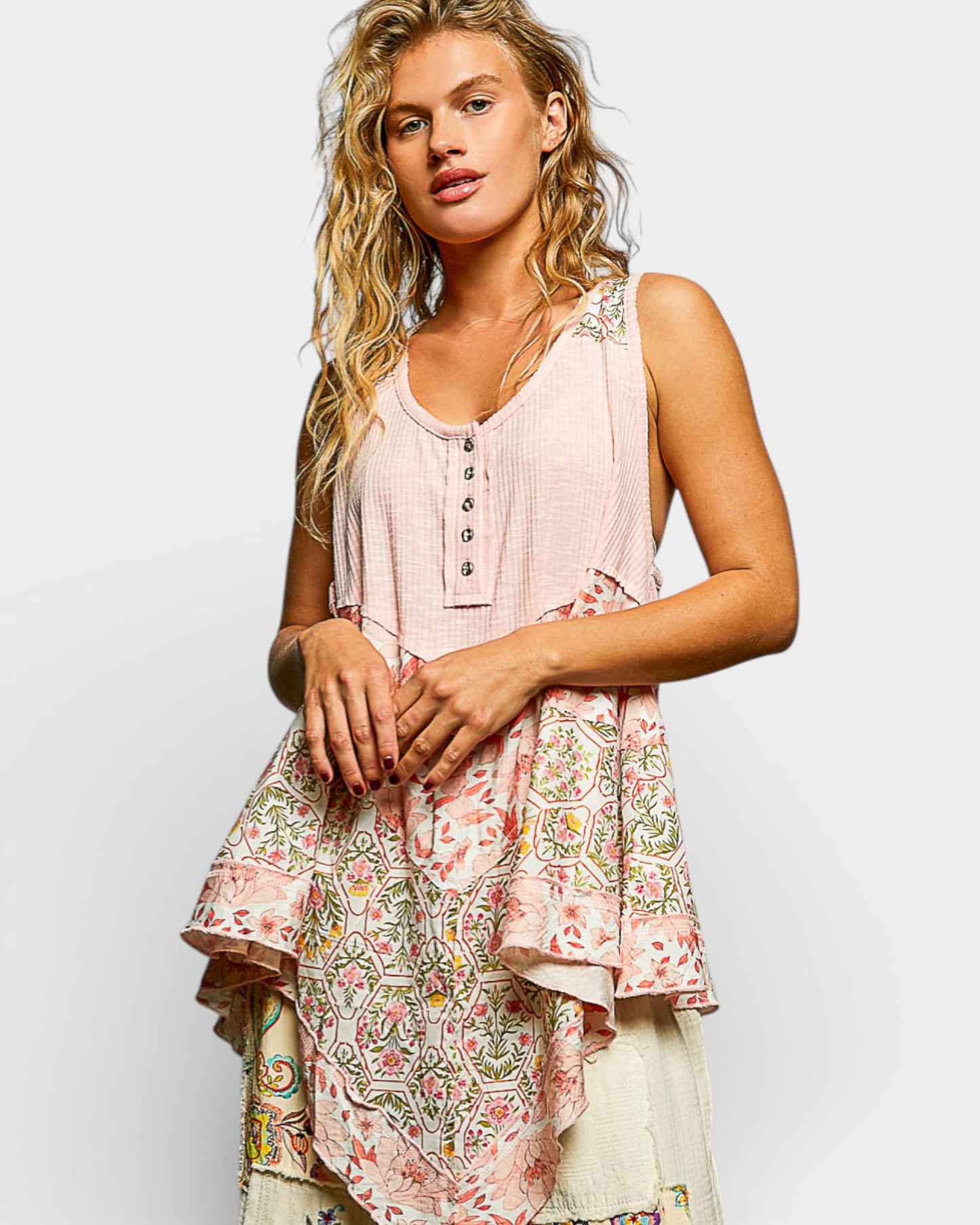 Woman wearing a floral dress with a light background