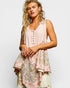 Woman wearing a floral dress with a light background