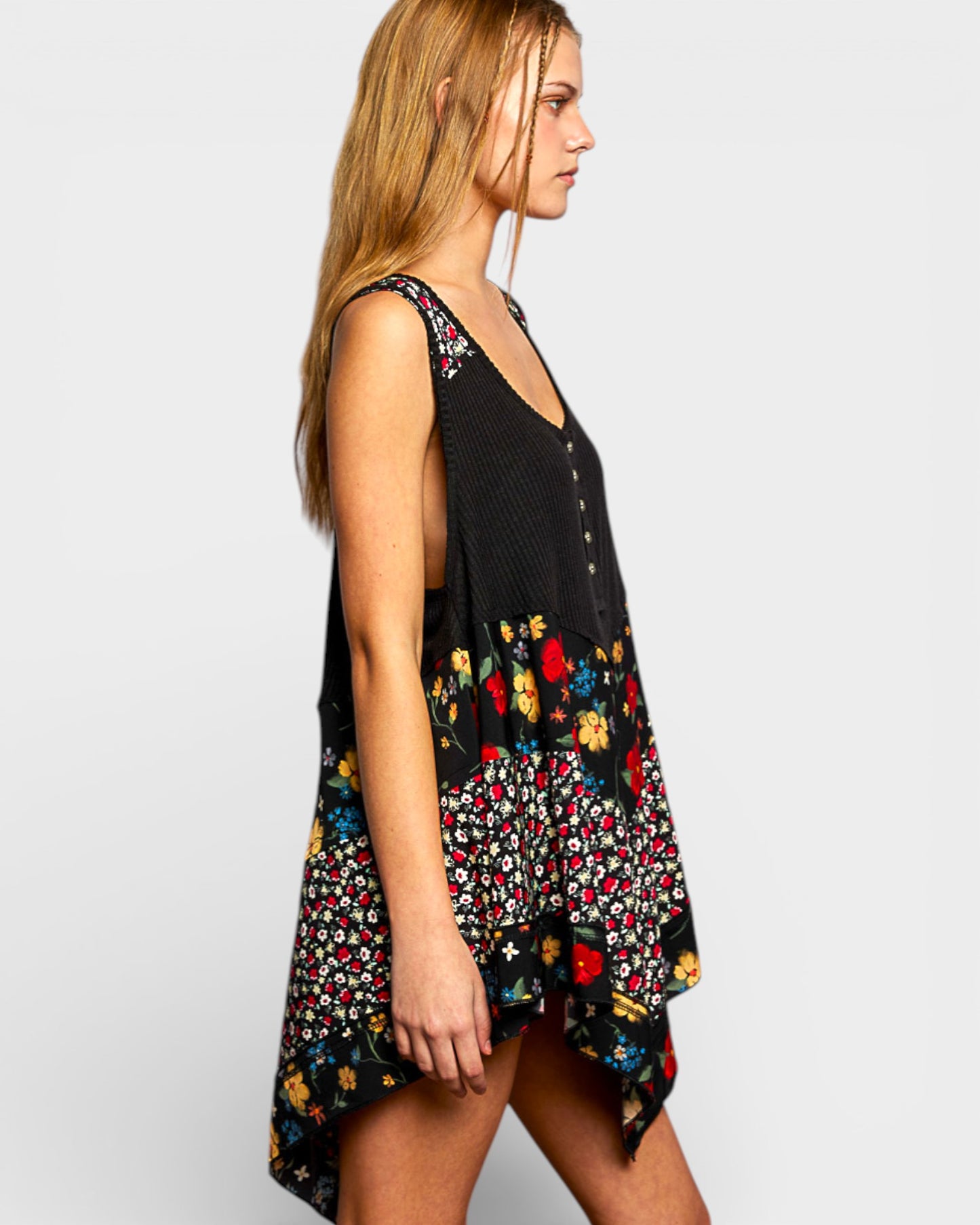 Woman wearing a black floral dress on a white background