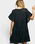 Black dress with ruffled sleeves on a white background