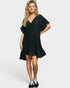 Woman wearing a black dress on a white background