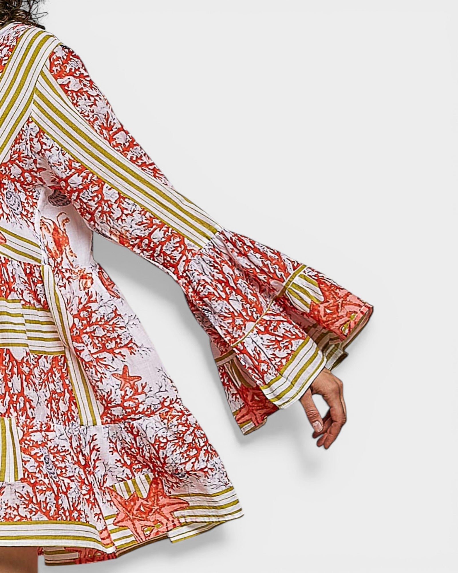 Colorful floral dress with bell sleeves on a white background