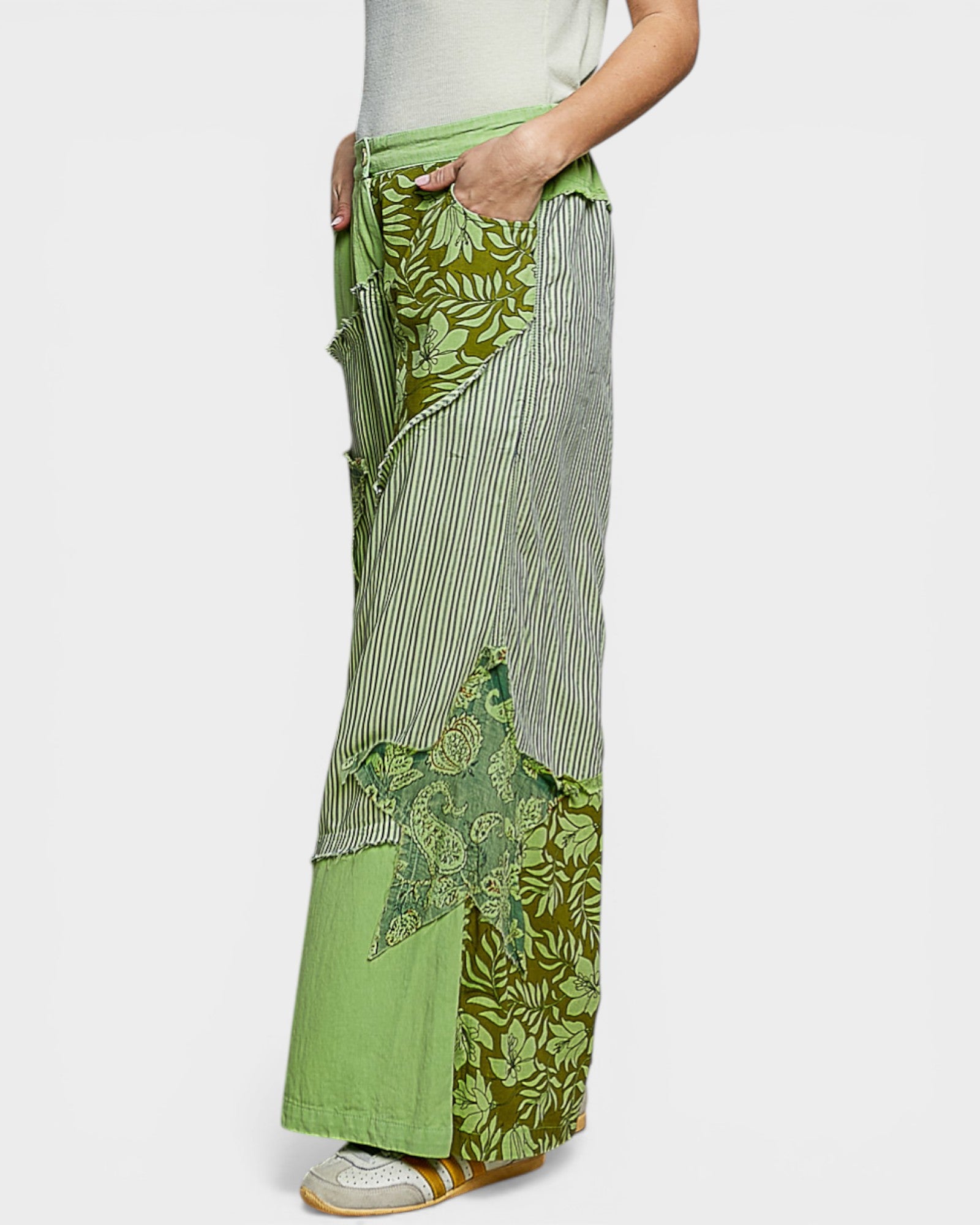 Green patterned skirt with a white background