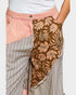 Skirt with floral and striped patterns on a plain background