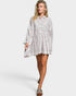 Woman wearing a striped shirt dress on a white background