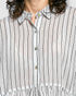 Close-up of a person wearing a white shirt with navy vertical stripes.