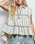 Woman wearing a sleeveless, striped blouse with a plain background