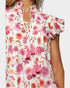Floral dress with pink tassels on a white background