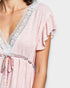 Pink dress with floral details on a white background