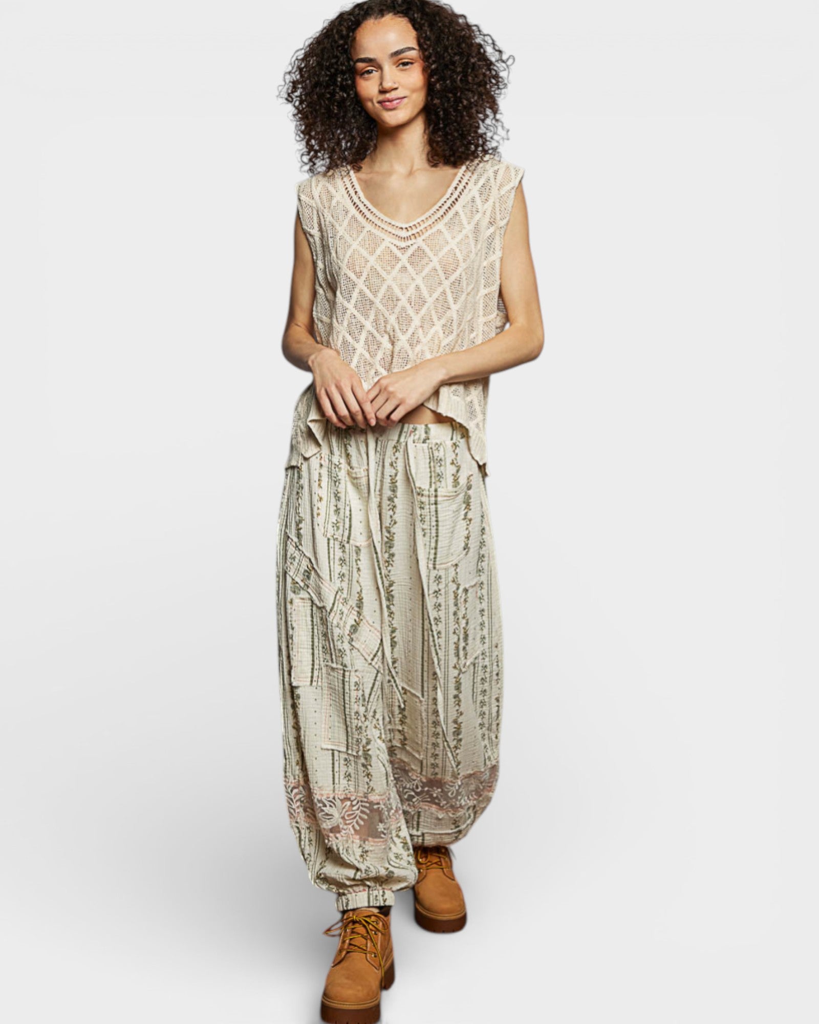 Woman wearing a patterned dress with a plain background