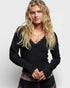 Woman wearing a black top with a white background
