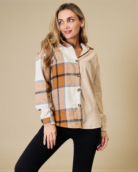 Woman wearing a plaid shirt with beige and brown tones on a beige background