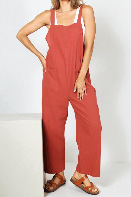Person wearing a red jumpsuit on a white background