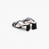 A pair of women's black mule sandals with square toes, featuring criss-crossing straps embellished with silver rhinestones and a chunky black block heel, shown on a light gray background.