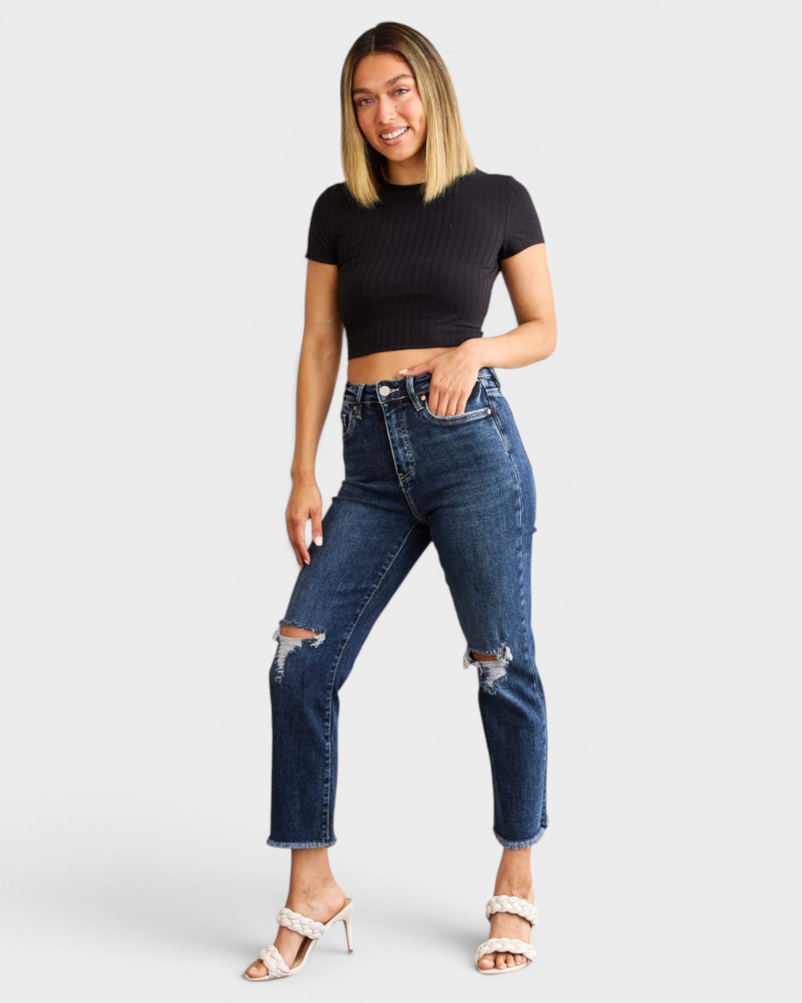 Jean taille haute délavé foncé avec ourlet brut et effet gainant