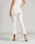 Person wearing white pants on a plain background