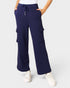 Navy cargo pants worn by a person on a light gray background