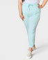 Light blue jogger pants worn by a person on a white background