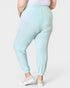 Light blue jogger pants worn by a person on a white background