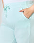 Light blue pants with a drawstring waist, worn by a person.