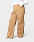 Person wearing tan pants on a white background