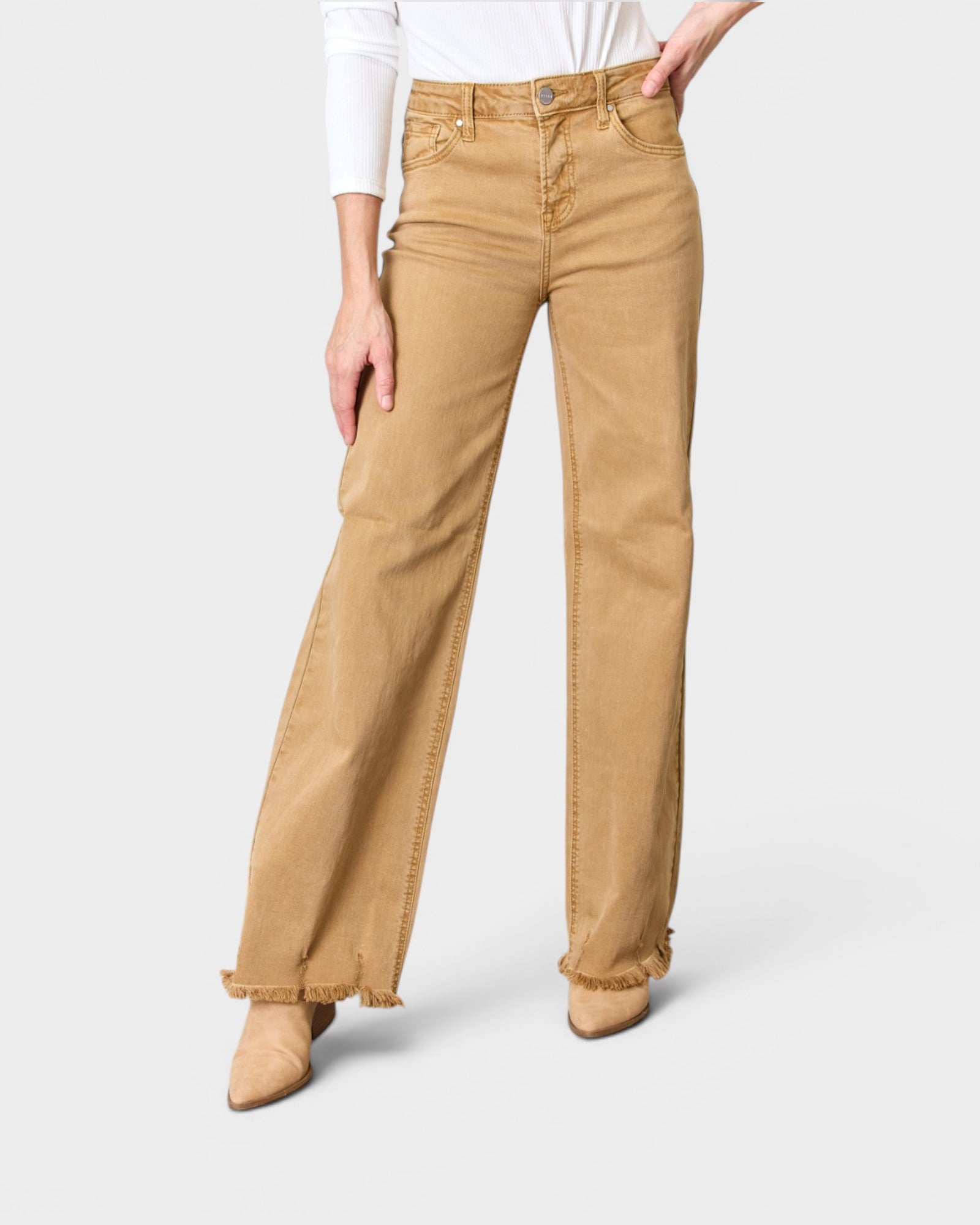 Person wearing tan pants on a white background