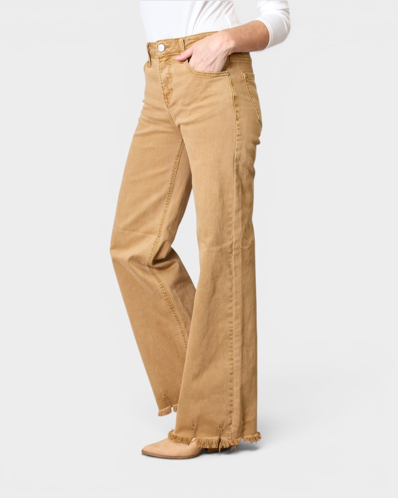 Tan pants worn by a person on a white background