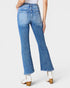 Person wearing blue jeans on a white background