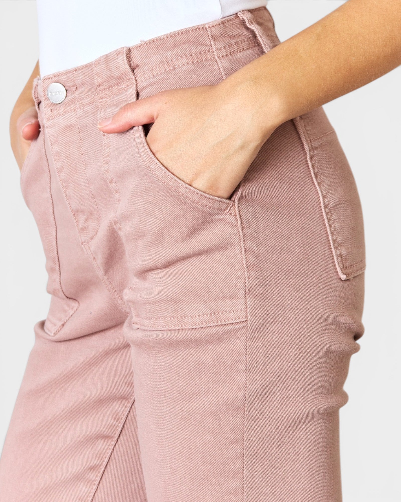 Close-up of pink pants with a plain background