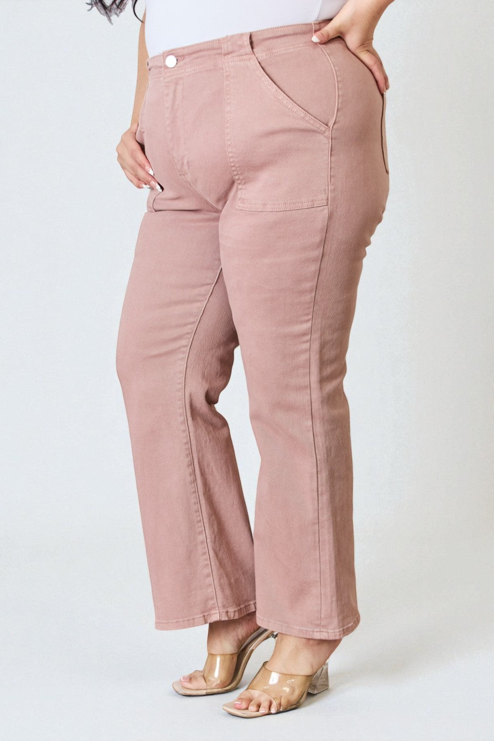 Person wearing pink pants on a white background