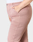 Pink pants worn by a person on a white background