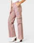 Pink cargo pants worn by a person on a white background