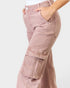 Pink cargo pants with a white background