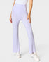 Person wearing light purple pants on a white background