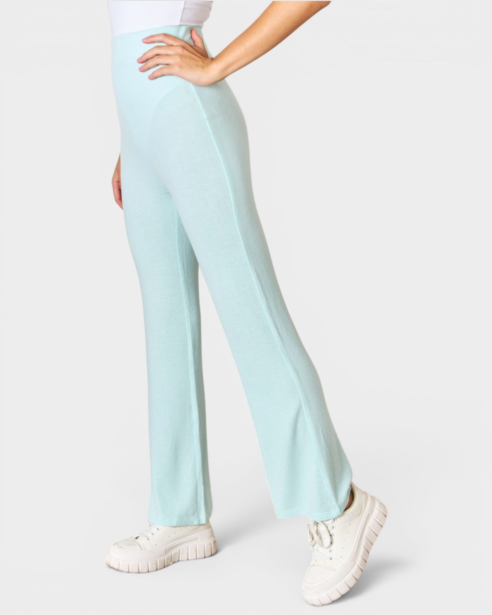 Light blue pants worn by a person on a white background
