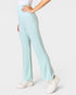 Light blue pants worn by a person on a white background
