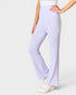 Person wearing light purple pants on a white background