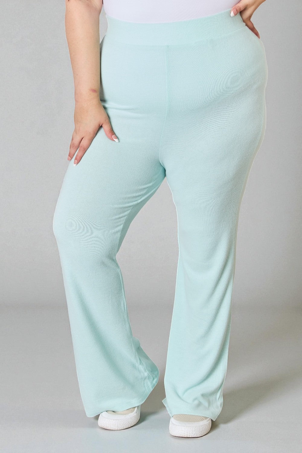 Light blue pants worn by a person on a gray background